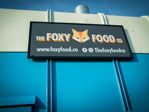 Image of the Foxy Food Co brand on the side of their catering trailer
